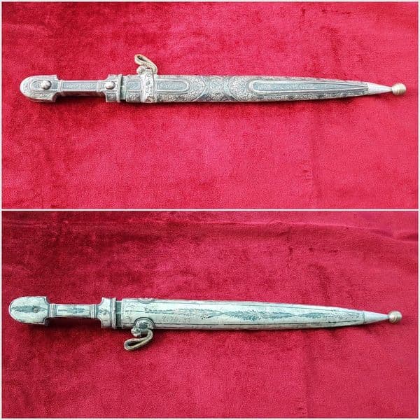 A fine Russian Kindjal the hilt and scabbard covered in nielloed silver mounts. Good condition. Ref 9825.